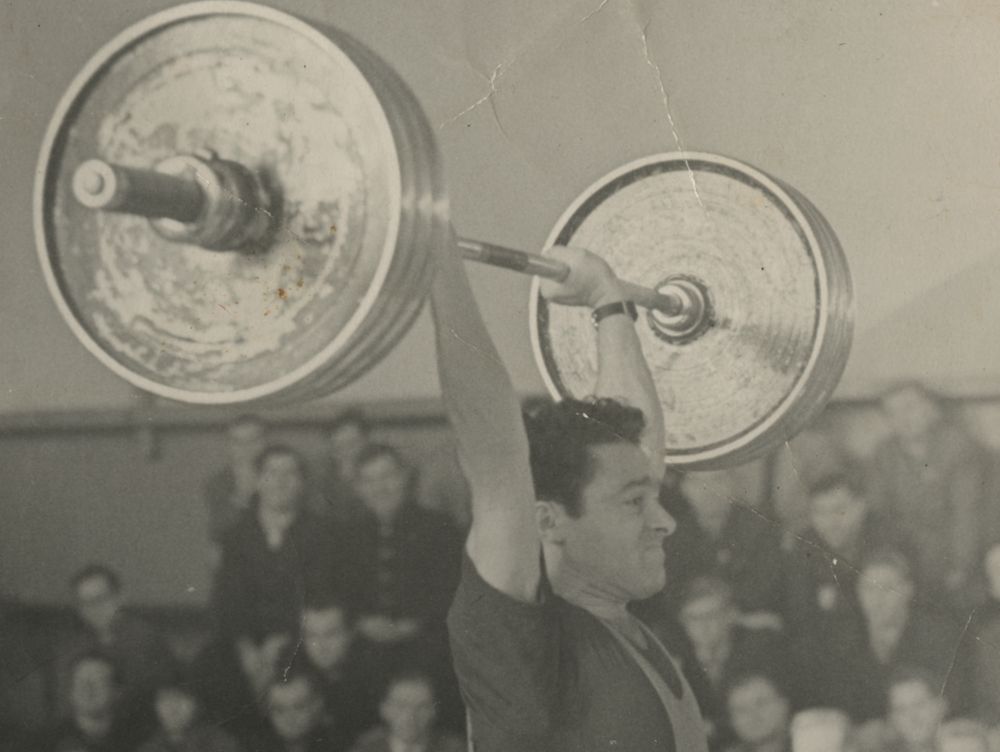 Photograph of Leonid Bronstein lifting a barbell, undated